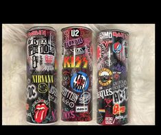 three different types of rolling stones tumblers on a white furnishing area, one is black and the other is red