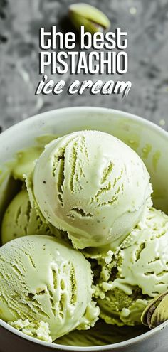 three scoops of ice cream in a bowl with pistachio on the side