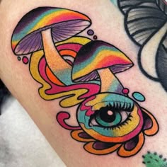 a colorful mushroom with an eye and rainbow colors on it's side ribcage