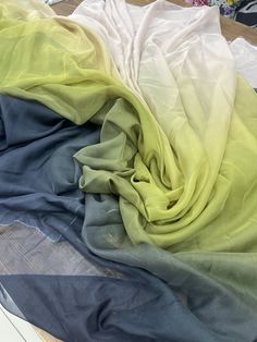 several different colored fabrics on top of each other