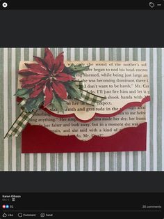 a red and white card with a poinsetti on it