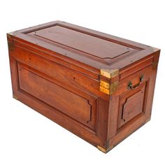 an old wooden chest with brass hardware and wood trimmings on the top, sitting against a white background