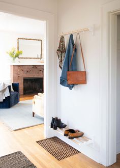 the entryway is clean and ready to be used as a shoe storage area for shoes