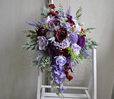 a bouquet of flowers sitting on top of a white chair