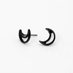 Adorn your ears with dainty crescent moons! These black stud earrings have post backs. Finish: Silver-tone Closure: Post back Material: Metal - Claire's Black Open Moon Stud Earrings Black Crescent Earrings For Pierced Ears, Black Earrings Studs, Adjustable Black Crescent Earrings, Black Moon Shaped Earrings For Gift, Black Moon Shaped Pierced Earrings, Black Moon Shaped Celestial Earrings, Small Black Earrings Studs, Black Crescent Moon Charm Earrings, Black Moon-shaped Pierced Earrings