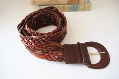 Lovely braided leather belt, made in Italy. Length with buckle approx. 43 inches | 110 cm. Width approx. 2.1 - 2.3 inches | 5.5 - 6 cm. In good vintage condition, but does show some signs of use/wear. ∞ Please remember this is a vintage item and will show some signs of use or wear. If you are in doubt as to the condition of the item please ask for clarification before you purchase. ∞ Color in photos may vary slightly depending on light and screen. ∞ If you buy multiple items from my shop, I may Vintage Pearl Brooch, Vintage Leather Belts, Braided Leather Belt, Beautiful Handwriting, Belt Brown, Vintage Leather Bag, Amber Earrings, Brown Leather Belt, Black Leather Bags