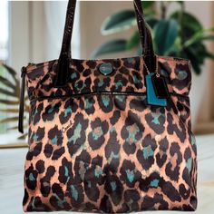 Coach H1394-F25282 Game Ocelot Print Tote Multi-Color Jade Leopard Print F25282 Tote Green And Black On Tan Print Sateen Fabric With Patent Leather Trim/Straps In Excellent, Light If At All Condition Measures: 11" Tall X 13" Wide X 4" Deep 7.25" Drop, Double Patent Leather Handles Crack In Center Of One Of The Handles On The Top Color Jade, Bags Coach, Leather Handles, Green And Black, Print Tote, Leather Trim, Leather Handle, Coach Bags, Leather Trims