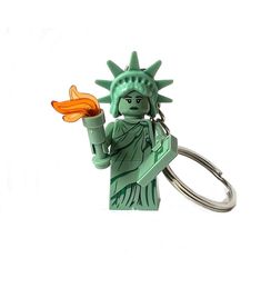 the statue of liberty is holding an orange object