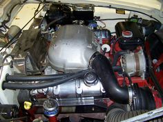 the engine compartment of a car with its hood open