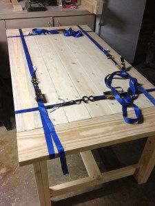 a wooden table with blue ribbon on it and the words, what a great idea for clampping long / short pieces of wood