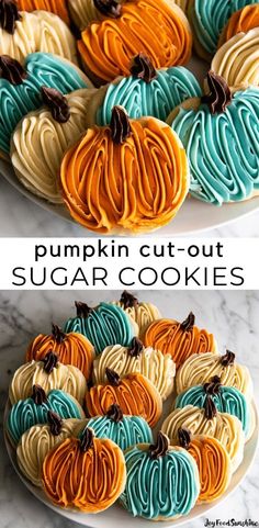 pumpkin cut - out sugar cookies with blue and orange frosting on top are sitting on a white plate