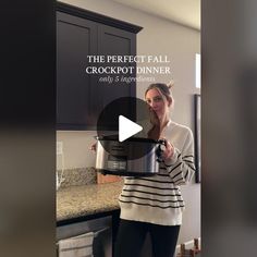 a woman standing in a kitchen holding a pot with the words, the perfect fall crockpot dinner on it's side