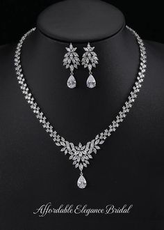 CZ Bridal and Special Occasion Jewelry Set This platinum silver plated jewelry set glistens with brilliant 5A quality marquise and teardrop shaped CZ crystals. The unique design will add a touch of sophisticated glamour to your special day. Size: The necklace is about 17 1/3" long and the pierced earrings are about 1 3/4" long. Color: Silver. Style: ne10984. Please allow 3 weeks for delivery. Shipping Policy . Return Policy Winter Wedding Accessories, Gold Bridesmaid Jewelry, Wedding Jewelry Set, Special Occasion Jewelry, Bridesmaid Pearls, Silver Wedding Jewelry, Pearl Jewelry Wedding, Bling Wedding, Gold Headband