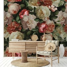 a floral wallpaper with pink and red flowers on the background is shown in this living room