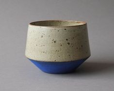 a white and blue bowl sitting on top of a table