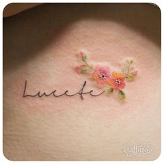 a woman's stomach with the word luae written in cursive writing