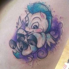 a tattoo with an image of a cartoon character on it's back side shoulder