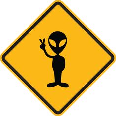 an alien crossing sign is shown in black and yellow, with the image of an alien pointing