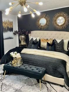 a bedroom with black and gold decor on the walls