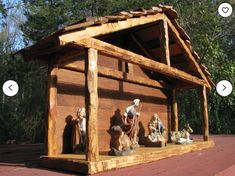 an outdoor nativity scene with figurines on the porch