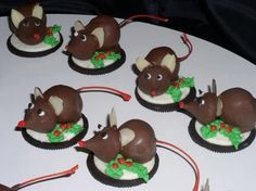 christmas mice on top of chocolate dipped cherrys for the bodyfati is cherry almond slice for the ears