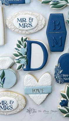 decorated cookies are arranged in the shape of letters