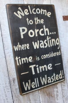 a wooden sign that reads welcome to the porch where washing time is considered well wasted