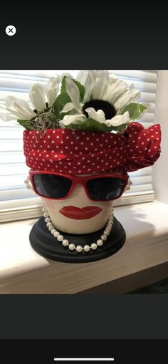 a flower pot with sunglasses on top of it