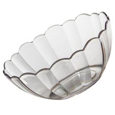 a glass bowl with wavy lines on the bottom is shown in front of a white background