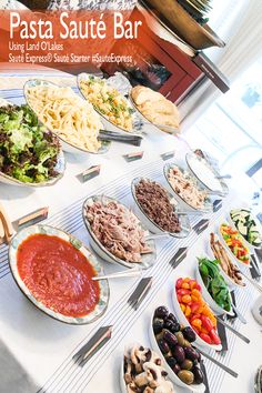 a table topped with lots of different types of food and condiments on top of it