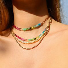 This brilliant and colorful choker is made of precious and rare natural gemstones, arranged to form a rainbow: Tanzanite, Blue Apatite, Topaz, Aquamarine, Peridot, Green Tourmaline, Tsavorite, Chrysoprase, Pink Tourmaline, Pink Sapphire, Ruby, Red Spinel, and Garnet.  This rainbow necklace features gemstones known for their healing properties. They promote vitality, creativity, and emotional healing, balance energy, clear blockages, boost confidence, and foster inner peace. A symbol of harmony, Colorful Layered Necklaces, Colorful Choker, Rainbow Choker, Balance Energy, Red Spinel, Gemstone Choker, Peridot Green, Rainbow Jewelry, Rainbow Necklace