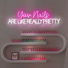 there is a neon sign that says your nails are like really pretty on the wall