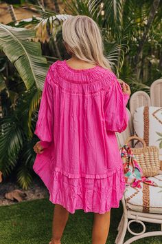 - Live your best beach life with this flowy dress! - Lightweight material with a built-in partial lining - A ruffled v-cut neckline with a tie detail - Gathered ruffles at the yoke - Long, loose sleeves with smocked cuffs - A relaxed silhouette that ends in a mini dress length hemline Beachy Flowy V-neck Mini Dress, Beachy V-neck Flowy Mini Dress, Pink V-neck Sundress For Beach, Pink V-neck Sundress, Pink V-neck Dresses For Vacation, Beachwear Mini Dress With Ruffles For Beach, Ruffled Mini Dress For Beach, Ruffled Mini Dress For Beach Season, Ruffled Sundress Beach Cover-up