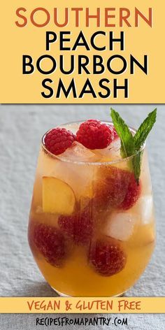 the southern peach bourbon smash is served in a glass with raspberries