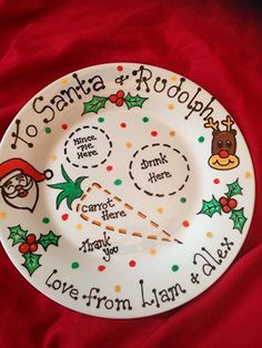 a christmas plate with santa and rudolph on it, which says i love from llan to sleigh