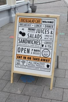 a sign that is on the ground near a sidewalk