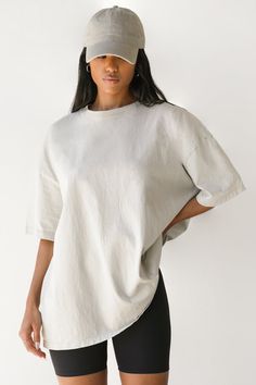 OVERSIZED BOYFRIEND TEE SILHOUETTE WITH DROPPED SHOULDERS. OUR HEAVYWEIGHT COTTON FABRIC IS VINTAGE-INSPIRED AND TIMELESS. IT GETS BETTER AND MORE WORN IN WITH EVERY WASH. JUST THE WAY YOU WANT IT. COLOR: FOG COTTON / WASHED BLACK COTTON SIZING: S/M (0-4), M/L (6-10) MODEL IS 5'8" AND WEARING A SIZE S/M FABRIC: 100% COTTON CARE: MACHINE WASH COLD WITH LIKE COLORS.CARE: TUMBLE DRY LOW. Solid Color Boxy Fit Crew Neck Top, Solid Boxy Fit Crew Neck Top, Solid Crew Neck Top With Boxy Fit, Boxy Fit Cotton Washed Top, Boxy Fit Washed Cotton Top, Relaxed Washed Cotton Tops, Oversized Crew Neck Top, Relaxed Fit Shirttail Hem Top, Relaxed Fit Tops With Shirttail Hem