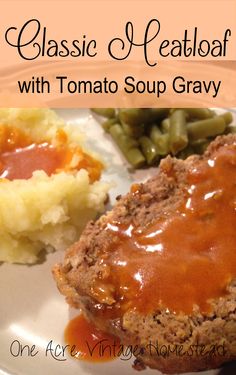 a plate with meatloaf, mashed potatoes and gravy on it