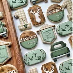 decorated cookies are displayed on a table with the names of their favorite people and animals