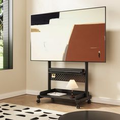 a flat screen tv mounted to the side of a wall