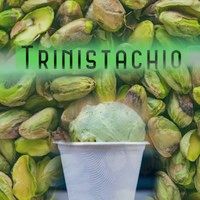 there is a white cup sitting in front of some pistachios with the word tristachio above it