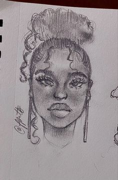 a pencil drawing of a woman's face with hair in buns and earrings