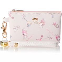 a pink purse with hello kitty on it and a keychain hanging from the front