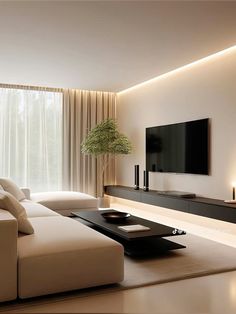 a living room with white furniture and a flat screen tv mounted on the wall above it