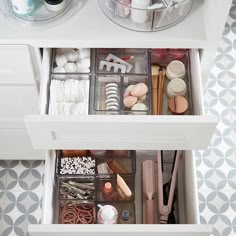 the drawers are organized with various items such as hair brushes, combs and other things