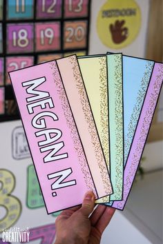 someone is holding up some cards that say we are vegan in pink and blue