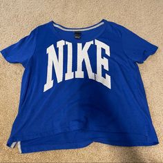 This Adorable Cropped Shirt Is Lightweight And Perfect For A Workout! It Is New Without Tags And Has Never Been Worn. Size Medium Blue Athleisure Tops With Letter Print, Blue Workout T-shirt With Letter Print, Blue T-shirt With Letter Print For Workout, Blue Letter Print T-shirt For Workout, Blue Cotton Workout T-shirt, Blue Cotton T-shirt For Workout, Logo Print Short Sleeve Workout Tops, Blue Short Sleeve Workout Top, Nike Athleisure Tops With Letter Print