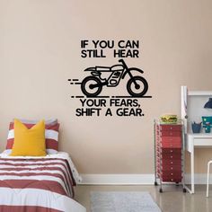 a bedroom with a wall sticker that says if you can still hear your ears, shift