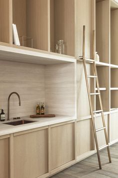 the kitchen is clean and ready to be used as a wine cellar or bar area