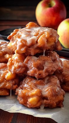 a pile of apple cider cookies sitting on top of a table next to an apple